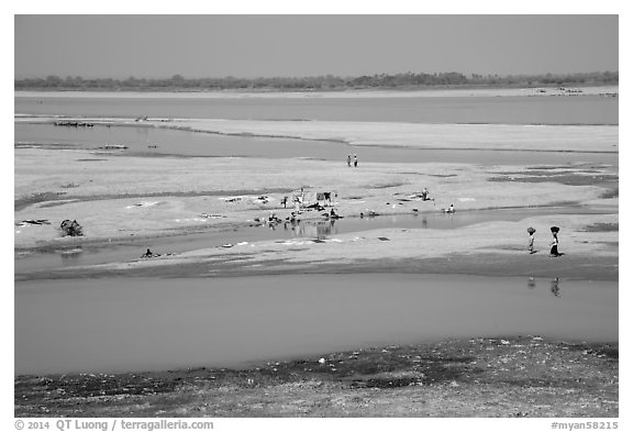 Sandy banks of Ayeyarwaddy River with villagers washing clothes. Bagan, Myanmar (black and white)