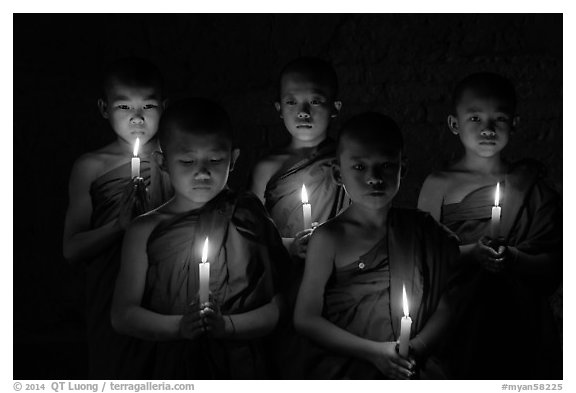 Young buddhist novices holding candles. Bagan, Myanmar (black and white)