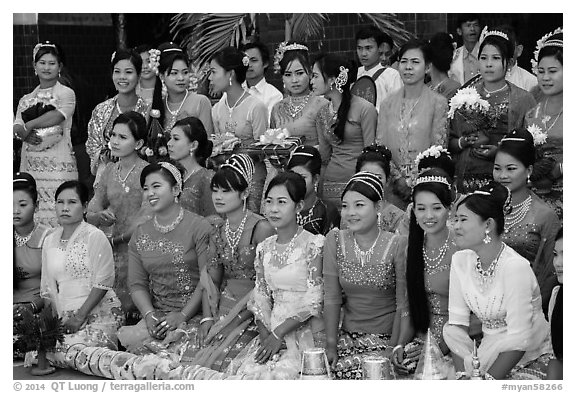 Women pose during novitiation ceremony, Mahamuni Pagoda. Mandalay, Myanmar (black and white)
