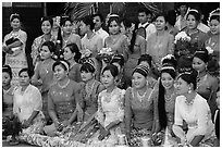 Women pose during novitiation ceremony, Mahamuni Pagoda. Mandalay, Myanmar ( black and white)