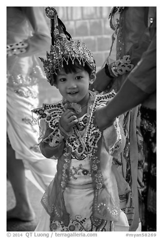 Young girl dressed in glittering attire during novitiation, Mahamuni Pagoda. Mandalay, Myanmar (black and white)