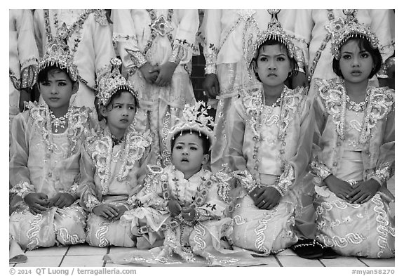 Girls and boy dressed in glittering clothes and make-up to look like princes, Novitiation, Mahamuni Pagoda. Mandalay, Myanmar (black and white)