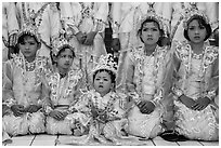 Girls and boy dressed in glittering clothes and make-up to look like princes, Novitiation, Mahamuni Pagoda. Mandalay, Myanmar ( black and white)