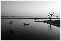 Tree skeletons and boats, Taungthaman Lake. Amarapura, Myanmar ( black and white)