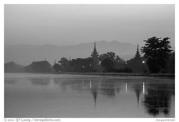 Pagodas reflected in moat at dawn, Mandalay Fort. Mandalay, Myanmar (black and white)