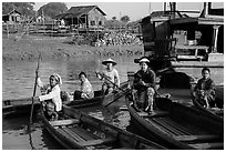 Row boats and huts on shore of Irrawaddy River. Mandalay, Myanmar ( black and white)