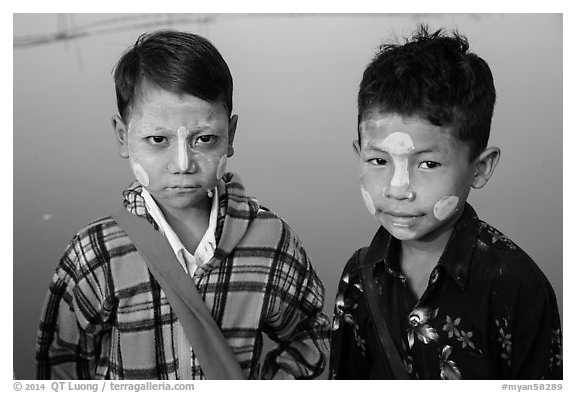 Boys wearing thanaka paste. Mandalay, Myanmar (black and white)