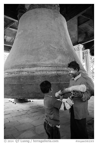 Children ring the huge Mingun bell, Mingun. Myanmar (black and white)