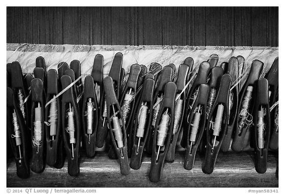 Close-up of yarn packages on loom. Amarapura, Myanmar (black and white)