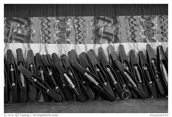 Close-up of loom in weaving workshop. Amarapura, Myanmar (black and white)