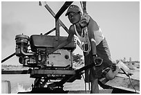 Boatman with one cylinder engine, Ava. Myanmar ( black and white)