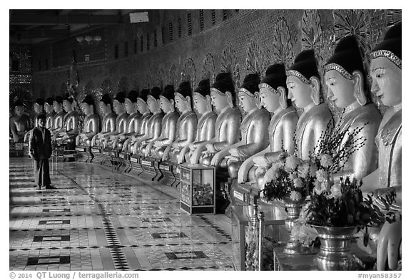 Buddha images in crescent-shaped hall, U Min Thonze pagoda, Sagaing. Myanmar (black and white)