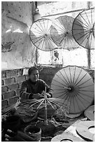 Woman assembling the paper umbrellas carried by the monks. Pindaya, Myanmar ( black and white)