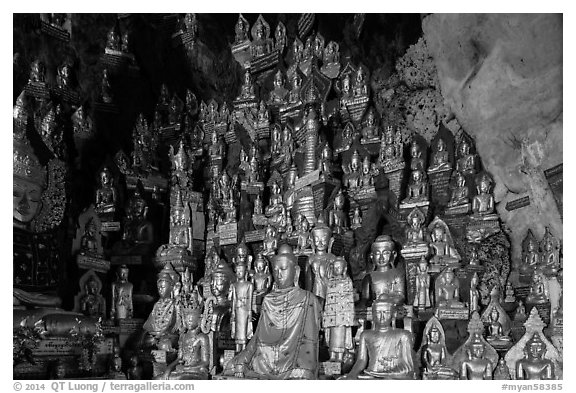 Buddha statues of all sizes near entrance of Pindaya Caves. Pindaya, Myanmar (black and white)