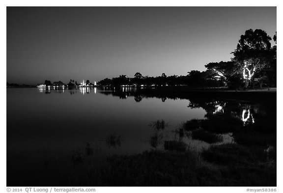 Pone Tanoke Lake at night with illuminated trees and pagoda. Pindaya, Myanmar (black and white)