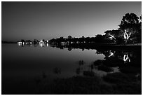 Pone Tanoke Lake at night with illuminated trees and pagoda. Pindaya, Myanmar ( black and white)
