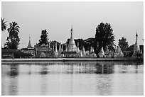 Pagoda reflected in Pone Tanoke Lake at dawn. Pindaya, Myanmar ( black and white)