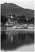 Hill and town reflected in Pone Tanoke Lake at dawn. Pindaya, Myanmar ( black and white)