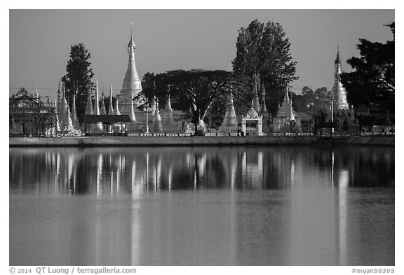Pagoda reflected in Pone Tanoke Lake at sunrise. Pindaya, Myanmar (black and white)
