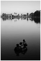 Woman washing laundry in Pone Tanoke Lake at sunrise. Pindaya, Myanmar ( black and white)