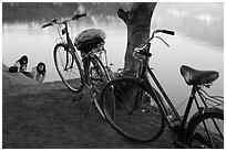 Bicycles and women doing laundry in Pone Tanoke Lake. Pindaya, Myanmar ( black and white)