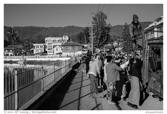 Women loading truck near market. Pindaya, Myanmar (black and white)