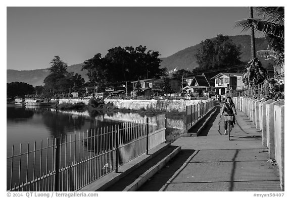 Woman biking near Pone Tanoke Lake. Pindaya, Myanmar (black and white)