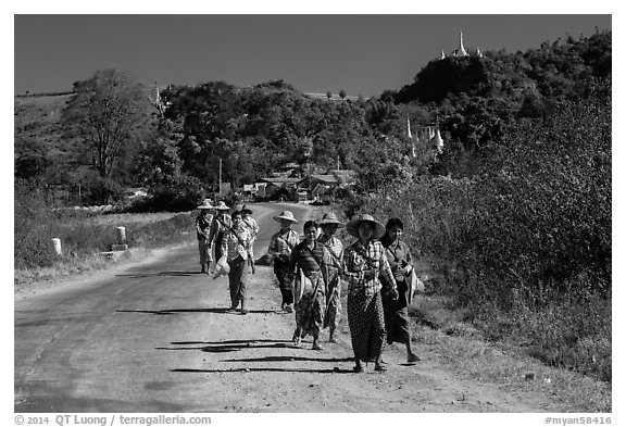 Women walking on road. Shan state, Myanmar (black and white)