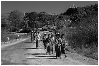 Women walking on road. Shan state, Myanmar ( black and white)