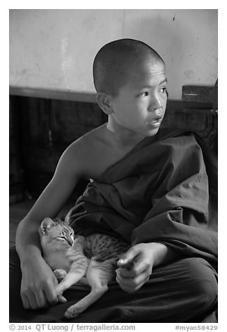 Novice petting cat, Shweyanpyay Monastery, Nyaung Shwe. Inle Lake, Myanmar (black and white)
