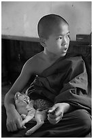 Novice petting cat, Shweyanpyay Monastery, Nyaung Shwe. Inle Lake, Myanmar ( black and white)