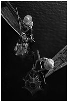 Intha fishermen use spear to stir weed and expose fish. Inle Lake, Myanmar ( black and white)