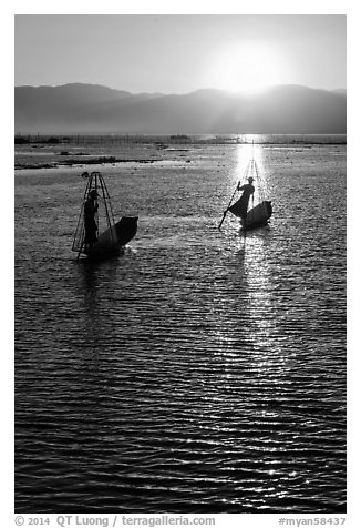 Intha fishermen with setting sun. Inle Lake, Myanmar (black and white)
