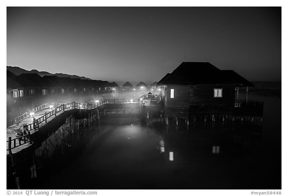 Cottages on stilts at dawn, Myanmar Treasure Resort. Inle Lake, Myanmar (black and white)