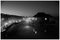 Cottages on stilts at dawn, Myanmar Treasure Resort. Inle Lake, Myanmar ( black and white)