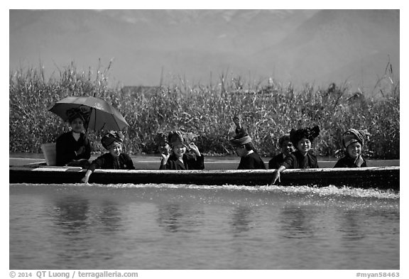 Women with turbans on long tail boat. Inle Lake, Myanmar (black and white)
