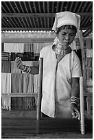 Padaung (long neck) woman threading yarn. Inle Lake, Myanmar ( black and white)