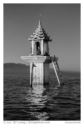 Water level marker topped by shrine. Inle Lake, Myanmar (black and white)