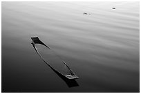 Sunken canoe and ripples. Inle Lake, Myanmar ( black and white)