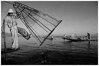Intha fisherman lifting conical net basket. Inle Lake, Myanmar ( black and white)