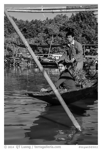 Couple leaving market on their boat. Inle Lake, Myanmar (black and white)