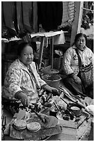 Woman cooking burmese pancakes at market. Inle Lake, Myanmar ( black and white)