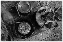 Pancackes cooked on coals. Inle Lake, Myanmar ( black and white)