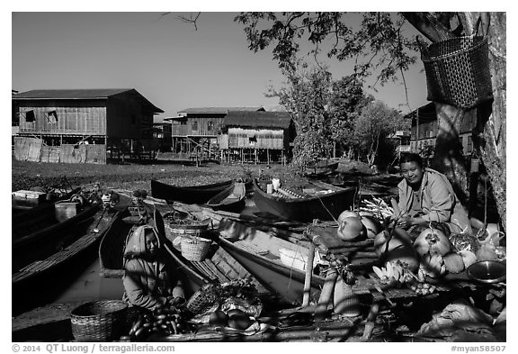 Market, boats, and village houses on stilts. Inle Lake, Myanmar (black and white)