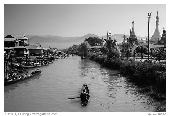 Boats and stupas bordering Ywama Village canal. Inle Lake, Myanmar (black and white)