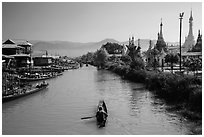 Boats and stupas bordering Ywama Village canal. Inle Lake, Myanmar ( black and white)