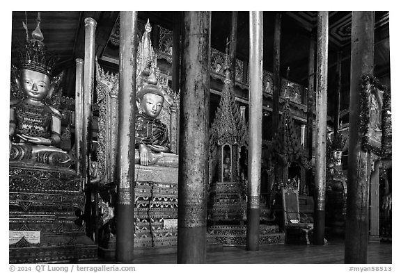 Old wood sculptures inside Nga Phe Kyaung monastery. Inle Lake, Myanmar (black and white)
