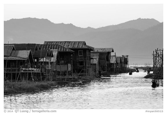 Houses and canal at sunset, Maing Thauk Village. Inle Lake, Myanmar (black and white)