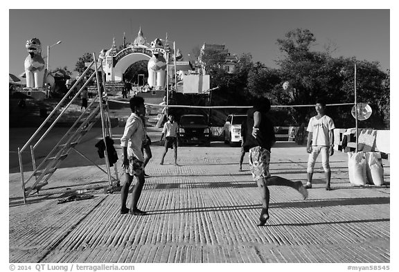 Young men play chin lone (kick volleyball) at Yatetaung. Kyaiktiyo, Myanmar (black and white)