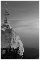 Sunset colors the sky above the Golden Rock. Kyaiktiyo, Myanmar ( black and white)